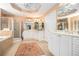 Bright main bathroom features double sinks, shower, bathtub, and ceramic tile flooring at 5004 Lake Mist Se Dr, Smyrna, GA 30126