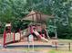 A playground with slides, stairs, and benches for playing in the park at 5004 Lake Mist Se Dr, Smyrna, GA 30126