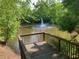 A view from a wooden deck shows a scenic pond with a fountain centerpiece at 5004 Lake Mist Se Dr, Smyrna, GA 30126