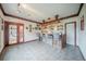 Basement bar area featuring seating for four, glass racks, decorative lighting, and stained glass entry door at 5610 Mountain Meadow Ct, Stone Mountain, GA 30087