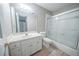 Well-lit bathroom with a vanity, a large mirror, and a shower-tub combination at 5610 Mountain Meadow Ct, Stone Mountain, GA 30087