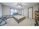 Bedroom with carpet floor, ceiling fan, desk, neutral walls, and window at 5610 Mountain Meadow Ct, Stone Mountain, GA 30087