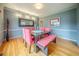 Formal dining room features gray walls, modern lighting, and a large square dining table with bench at 5610 Mountain Meadow Ct, Stone Mountain, GA 30087