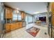 Bright kitchen with wood cabinets, stainless steel appliances, and adjacent dining area at 5610 Mountain Meadow Ct, Stone Mountain, GA 30087