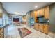 Classic kitchen with wood cabinetry, tile floors, and a view into the dining area at 5610 Mountain Meadow Ct, Stone Mountain, GA 30087