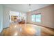 Bright living room with hardwood floors, fireplace and large windows providing lots of natural light at 5610 Mountain Meadow Ct, Stone Mountain, GA 30087