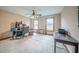 Home office space with neutral walls, a ceiling fan, and two large windows at 5610 Mountain Meadow Ct, Stone Mountain, GA 30087
