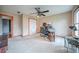 Office area featuring a ceiling fan, neutral walls, and a doorway visible at 5610 Mountain Meadow Ct, Stone Mountain, GA 30087
