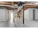 Large unfinished basement with concrete floors and exposed ceiling with pipes at , Mableton, GA 30126