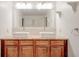Bright bathroom features a double sink vanity with granite countertop and a large mirror at , Mableton, GA 30126