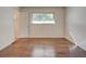 Bedroom with hardwood floors, a window, and white walls at , Mableton, GA 30126