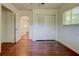 Bedroom with hardwood floors, a closet, and a window for natural light at , Mableton, GA 30126