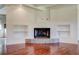 Living room featuring hardwood floors, built-in shelves and a stone fireplace at , Mableton, GA 30126