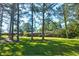 View of home through the trees from front yard at , Mableton, GA 30126
