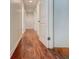 Hallway with hardwood floors and white doors, creating a clean and modern look at , Mableton, GA 30126