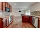 Stylish kitchen with dark wood cabinetry, granite countertops, and stainless steel appliances at , Mableton, GA 30126