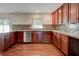 Kitchen featuring granite countertops, stainless steel dishwasher, and dark wood cabinets at , Mableton, GA 30126