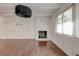 Cozy living room features a fireplace, hardwood floors, and a modern lighting fixture at , Mableton, GA 30126