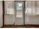 Screened porch door leading out to a wood deck and backyard at , Mableton, GA 30126