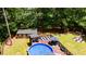 Aerial view of a home featuring a pool, hot tub, firepit, and a large backyard for outdoor enjoyment at 173 Avalon Way, Riverdale, GA 30274