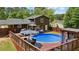 The backyard offers a pool, hot tub, deck, and plenty of space for entertaining at 173 Avalon Way, Riverdale, GA 30274