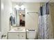 A small bathroom features a shower/tub, a sink, a toilet, and neutral walls at 173 Avalon Way, Riverdale, GA 30274