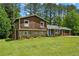 Charming two-story home with well-maintained lawn and beautiful landscaping at 173 Avalon Way, Riverdale, GA 30274