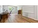 Versatile finished basement space featuring wood-look floors, a large window, and neutral wall colors at 1820 Habersham Gate Dr, Cumming, GA 30041