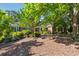 Well-maintained, lush front yard and mature trees offer ample shade on this stunning brick home at 1820 Habersham Gate Dr, Cumming, GA 30041