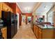 Open kitchen and living room area with stone countertops and stainless steel fridge at 1820 Habersham Gate Dr, Cumming, GA 30041