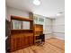Home office space with wood-look floors, natural light and wooden shelving and cabinets at 1820 Habersham Gate Dr, Cumming, GA 30041