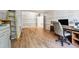 Office space in a finished basement with wood-look floors, natural light, and office setup with desk and chair at 1820 Habersham Gate Dr, Cumming, GA 30041