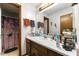 Bathroom showcasing vanity space, mirror, and shower with curtain at 4720 Bill Cheek Rd, Auburn, GA 30011