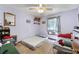 Cozy bedroom with carpet, natural light, and vintage decor at 4720 Bill Cheek Rd, Auburn, GA 30011