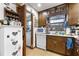 Classic kitchen with wood cabinets, white appliances, and ample counter space at 4720 Bill Cheek Rd, Auburn, GA 30011