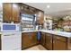 Bright kitchen with classic wood cabinets, countertops, and white appliances at 4720 Bill Cheek Rd, Auburn, GA 30011