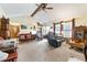 Bright living room with vaulted ceiling, ceiling fan, and neutral carpet at 4720 Bill Cheek Rd, Auburn, GA 30011