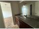 Bathroom featuring granite countertops, wood cabinets, and neutral decor at 545 Tulip Ln, Mcdonough, GA 30252