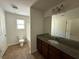 Full bathroom featuring granite-topped vanity, white fixtures, and tile flooring at 545 Tulip Ln, Mcdonough, GA 30252