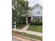 Charming two-story townhouse with brick accents, landscaped yard, and well-maintained walkway at 545 Tulip Ln, Mcdonough, GA 30252