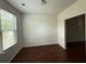 Bright living room featuring hardwood floors, ample natural light, and neutral wall color at 545 Tulip Ln, Mcdonough, GA 30252