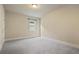 Carpeted bedroom with neutral walls and a bright window with a view of outdoors at 6805 Bransford Dr, Cumming, GA 30040