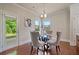 Charming breakfast nook with a glass table, seating for four, and a view of the backyard at 6805 Bransford Dr, Cumming, GA 30040