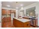 Bright and modern kitchen with a granite island, stainless steel appliances, and hardwood floors at 6805 Bransford Dr, Cumming, GA 30040