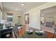Open concept living area with hardwood floors, natural light, and access to other rooms at 6805 Bransford Dr, Cumming, GA 30040