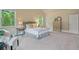Bright main bedroom with a gray upholstered bed and serene decor at 6805 Bransford Dr, Cumming, GA 30040