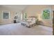 Spacious main bedroom with vaulted ceiling, neutral colors, and natural light at 6805 Bransford Dr, Cumming, GA 30040