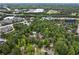 Overhead shot of a house in a wooded area, showcasing its proximity to retail areas and highways at 9438 Cedar Creek Pl, Douglasville, GA 30135
