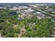 An aerial view showcasing a peaceful community with lush trees, close to retail amenities and easy highway access at 9438 Cedar Creek Pl, Douglasville, GA 30135