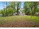 Secluded home situated on a large lot with a private backyard and mature trees at 9438 Cedar Creek Pl, Douglasville, GA 30135